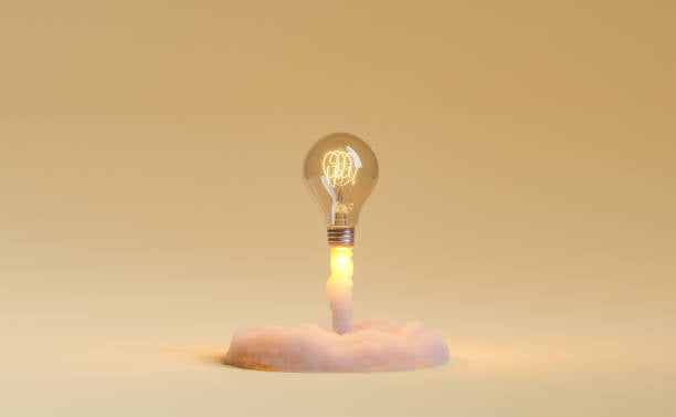 Lightbulb on Plain Cream Background